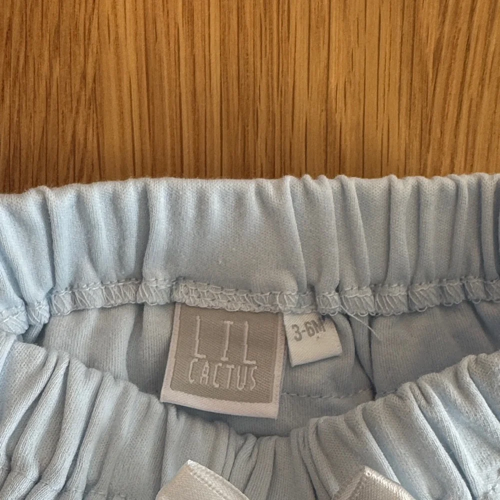 Charming White and Blue Diaper Covers with Bows